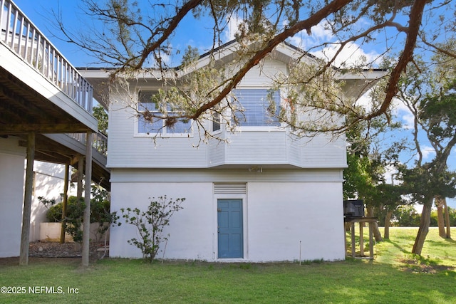 rear view of house with a lawn