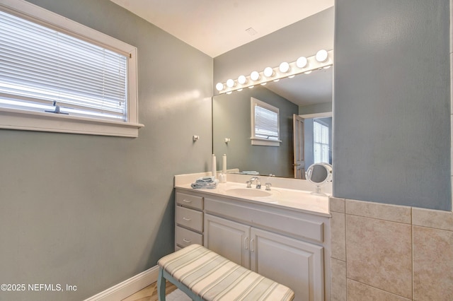 bathroom with vanity and baseboards