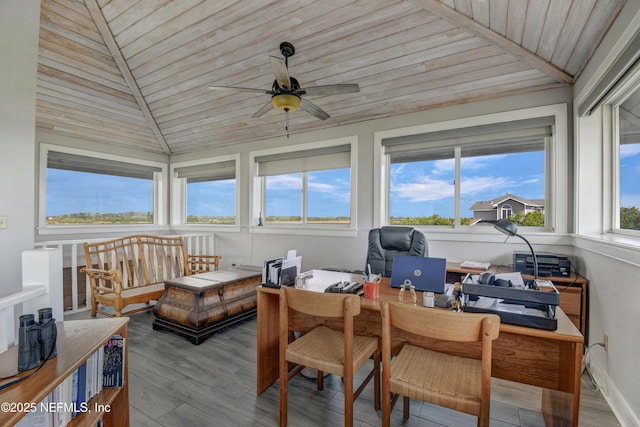 sunroom / solarium featuring wood ceiling, vaulted ceiling, and wood finished floors