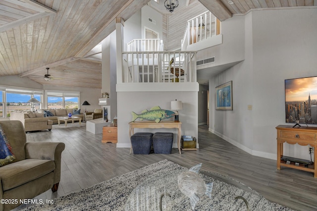 living room with high vaulted ceiling, ceiling fan, baseboards, wooden ceiling, and wood finished floors