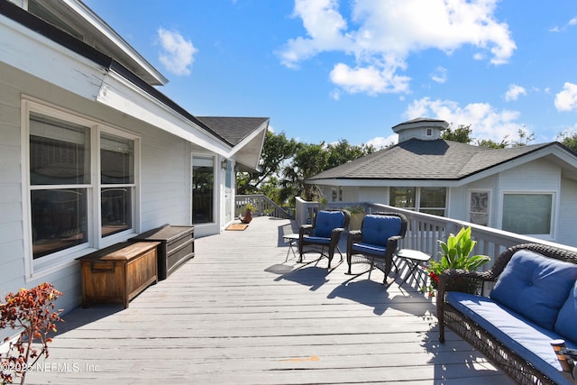 deck featuring outdoor lounge area