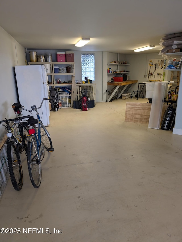 garage with freestanding refrigerator