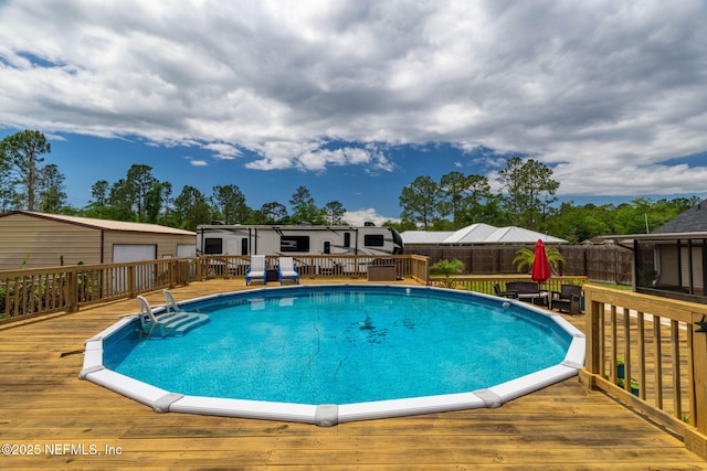 4384 Hickory St, Macclenny, FL 32063 - view of swimming pool with a wooden deck and fence