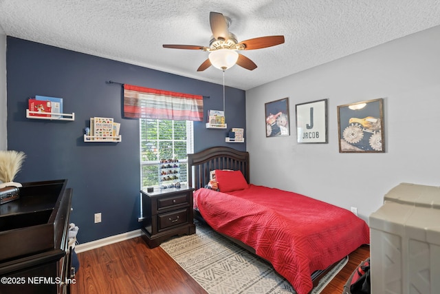 4384 Hickory St, Macclenny, FL 32063 - bedroom featuring wood finished floors, a textured ceiling, baseboards, and ceiling fan
