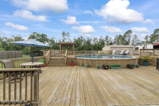 4384 Hickory St, Macclenny, FL 32063 - wooden terrace featuring outdoor dining area and fence