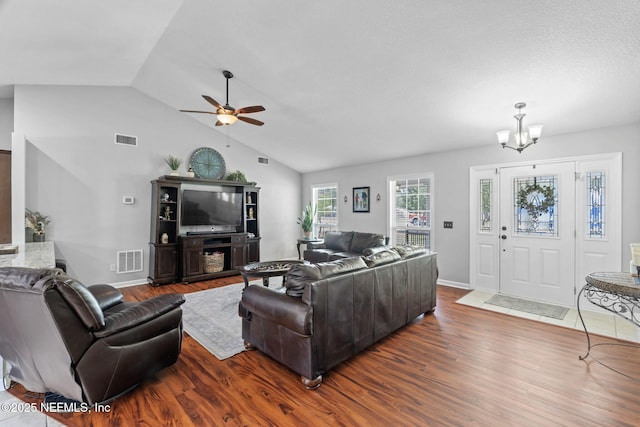 4384 Hickory St, Macclenny, FL 32063 - living area featuring a chandelier, wood finished floors, a ceiling fan, high vaulted ceiling, and baseboards