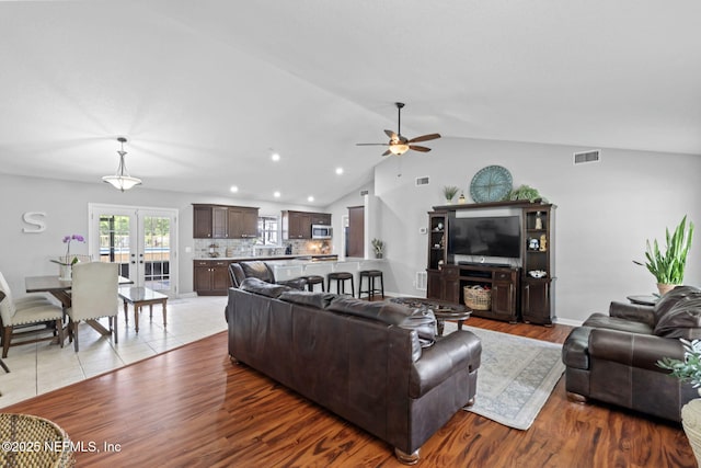 4384 Hickory St, Macclenny, FL 32063 - living room featuring ceiling fan, french doors, light wood finished floors, lofted ceiling, and recessed lighting