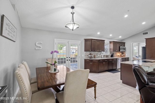 4384 Hickory St, Macclenny, FL 32063 - dining area with french doors, light tile patterned flooring, vaulted ceiling, and recessed lighting
