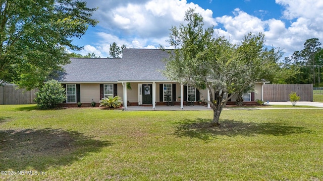 4384 Hickory St, Macclenny, FL 32063 - view of front of house featuring a shingled roof and covered porch