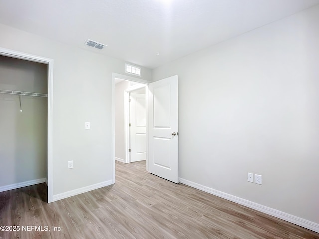 11462 Oakfield Ct, Jacksonville, FL 32258 - unfurnished bedroom with light wood finished floors, baseboards, a closet, and visible vents