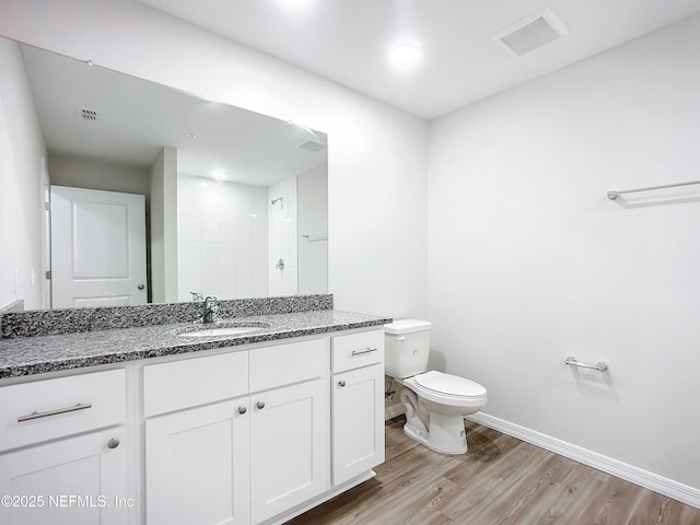 11462 Oakfield Ct, Jacksonville, FL 32258 - bathroom featuring toilet, wood finished floors, visible vents, baseboards, and vanity