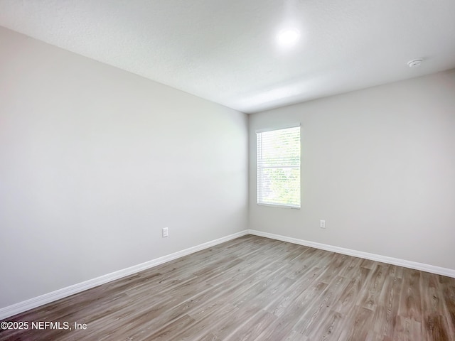 11462 Oakfield Ct, Jacksonville, FL 32258 - empty room with light wood-style flooring and baseboards