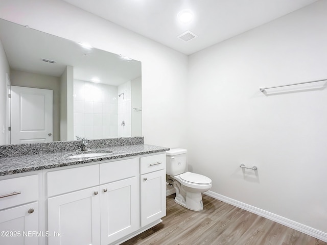 11462 Oakfield Ct, Jacksonville, FL 32258 - full bath featuring baseboards, wood finished floors, tiled shower, toilet, and vanity