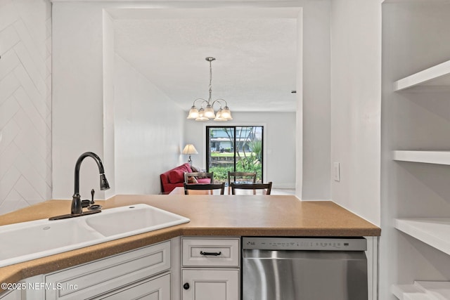 2032 Sea Hawk Cir, Ponte Vedra Beach, FL 32082 - kitchen featuring stainless steel dishwasher, a sink, white cabinets, a chandelier, and decorative light fixtures