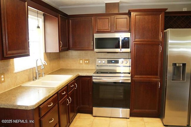 10306 Jolynn Rd, Jacksonville, FL 32225 - kitchen featuring stainless steel appliances, a sink, backsplash, light countertops, and light tile patterned floors