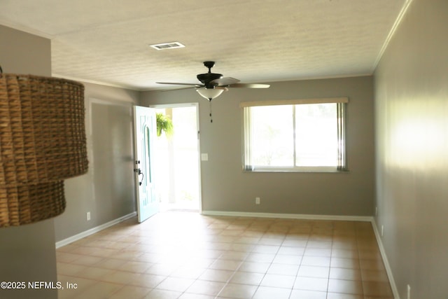10306 Jolynn Rd, Jacksonville, FL 32225 - spare room featuring ceiling fan, light tile patterned floors, crown molding, and baseboards