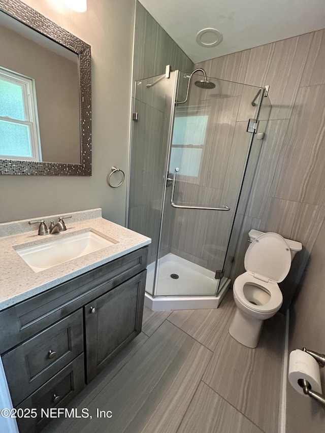10306 Jolynn Rd, Jacksonville, FL 32225 - bathroom with a stall shower, vanity, and toilet
