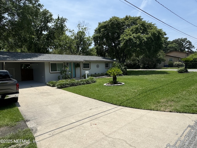 10306 Jolynn Rd, Jacksonville, FL 32225 - single story home with concrete driveway, a front yard, and an attached carport