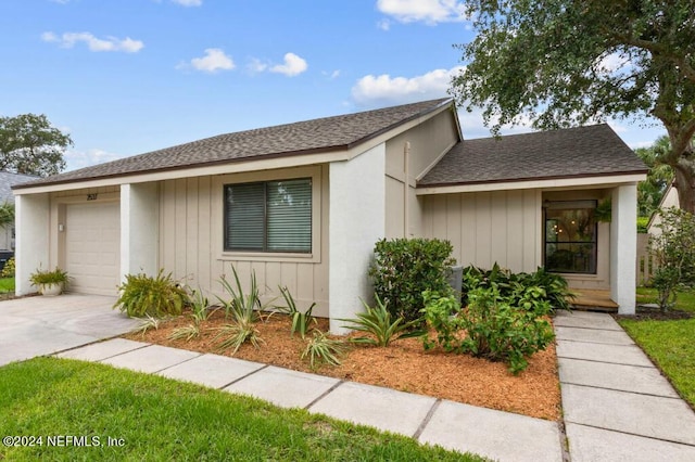 2537 Dauphine Ct E, Ponte Vedra Beach, FL 32082 - view of front of property with a garage, roof with shingles, and driveway