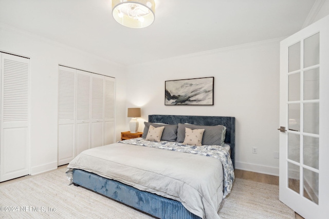 2537 Dauphine Ct E, Ponte Vedra Beach, FL 32082 - bedroom with wood finished floors, crown molding, and two closets