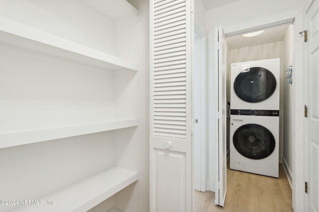2537 Dauphine Ct E, Ponte Vedra Beach, FL 32082 - washroom with stacked washer / dryer and light wood-style flooring