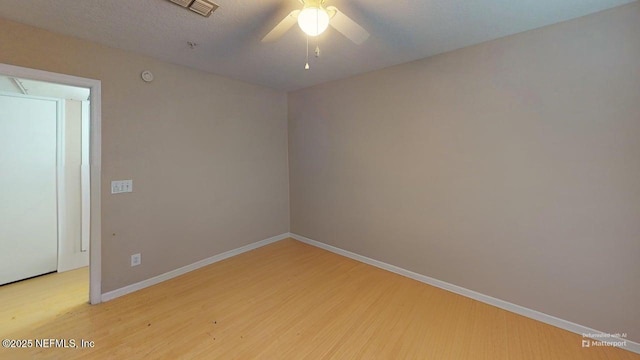 7701 Timberlin Park Blvd Unit 623, Jacksonville, FL 32256 - spare room featuring ceiling fan, wood finished floors, and baseboards