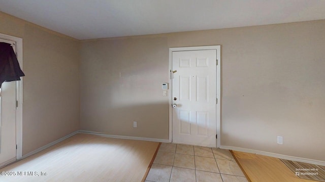 7701 Timberlin Park Blvd Unit 623, Jacksonville, FL 32256 - empty room featuring light tile patterned floors and baseboards