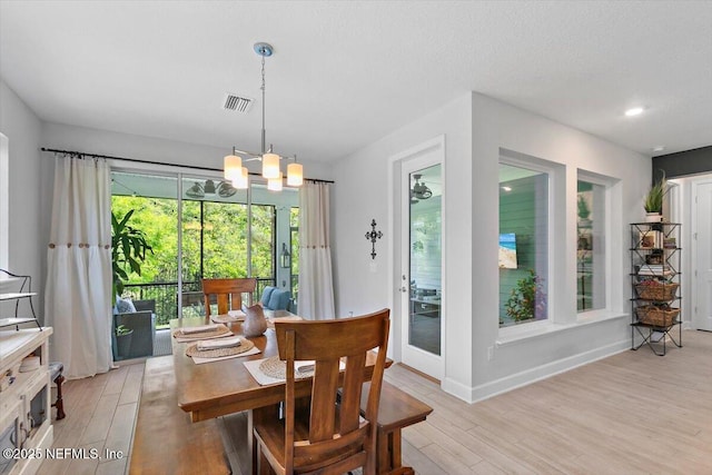 169 Rivercliff Trl, Saint Augustine, FL 32092 - dining room featuring light wood finished floors, a chandelier, and baseboards