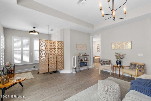 169 Rivercliff Trl, Saint Augustine, FL 32092 - living room with a chandelier, baseboards, and wood finished floors