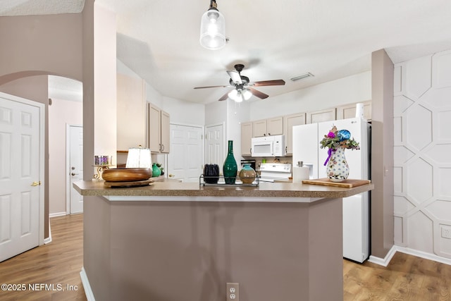 kitchen with white appliances, light wood-type flooring, visible vents, ceiling fan, and arched walkways