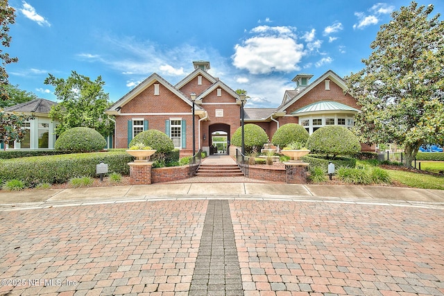 view of front of home featuring brick siding