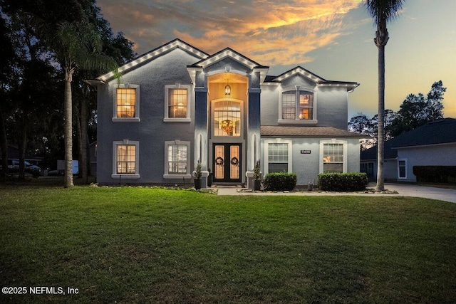 11698 Donato Dr, Jacksonville, FL 32226 - view of front facade featuring french doors, a front yard, and stucco siding