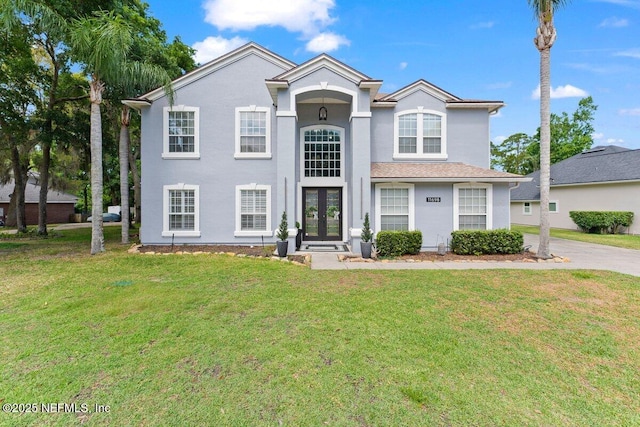 11698 Donato Dr, Jacksonville, FL 32226 - view of front of home featuring french doors, a front yard, and stucco siding