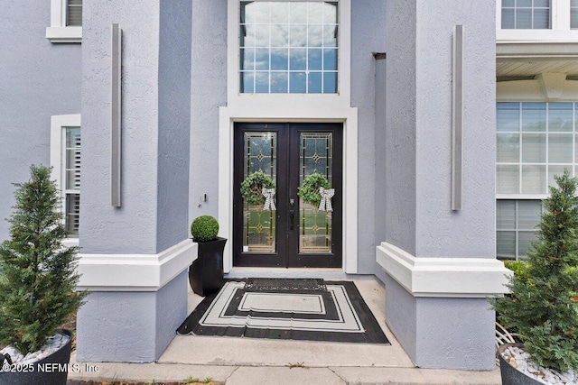 11698 Donato Dr, Jacksonville, FL 32226 - entrance to property with french doors and stucco siding