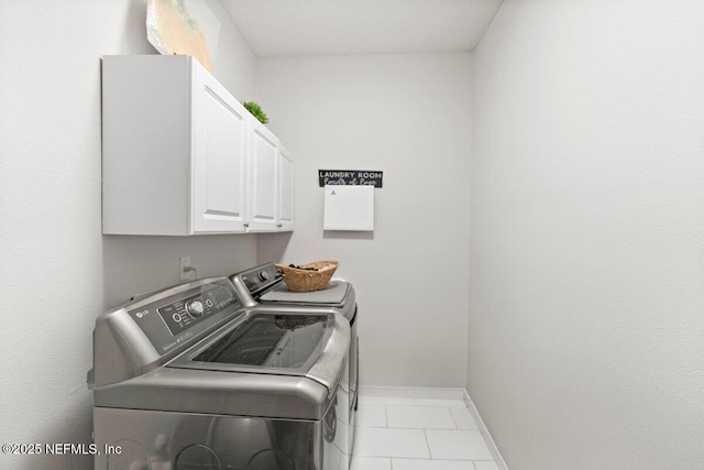 11698 Donato Dr, Jacksonville, FL 32226 - washroom with washing machine and dryer, cabinet space, baseboards, and tile patterned flooring