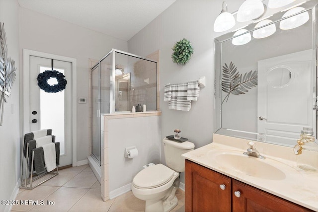 11698 Donato Dr, Jacksonville, FL 32226 - bathroom with a stall shower, vanity, toilet, and tile patterned flooring
