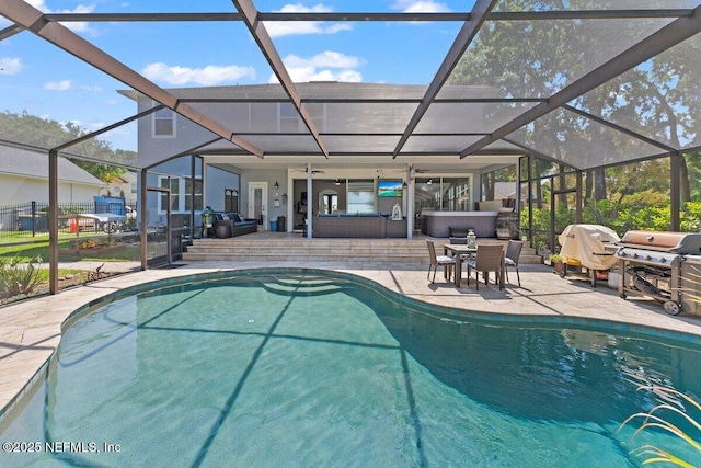 11698 Donato Dr, Jacksonville, FL 32226 - outdoor pool featuring a patio, glass enclosure, ceiling fan, and a grill