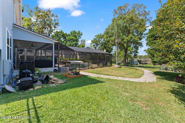 11698 Donato Dr, Jacksonville, FL 32226 - view of grassy yard featuring a ceiling fan and glass enclosure