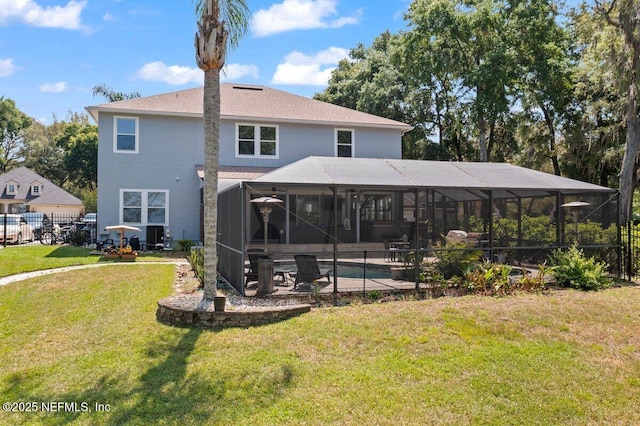 11698 Donato Dr, Jacksonville, FL 32226 - back of house featuring a patio area, an outdoor pool, a shingled roof, and glass enclosure
