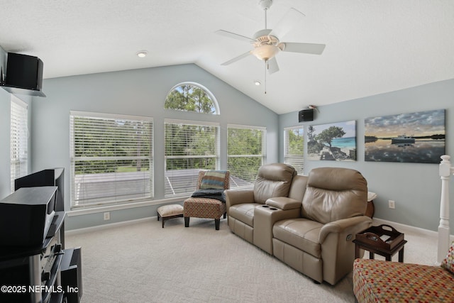 carpeted living area with ceiling fan, lofted ceiling, and baseboards