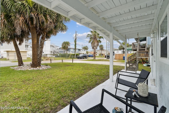 2902 W 5th St, Fernandina Beach, FL 32034 - view of green lawn with a residential view and stairs