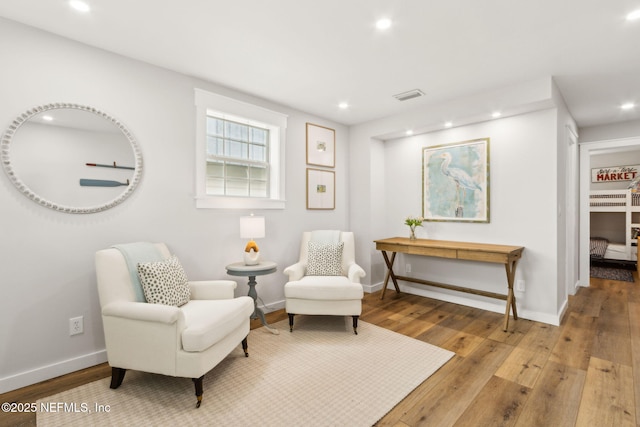 2902 W 5th St, Fernandina Beach, FL 32034 - sitting room featuring hardwood / wood-style floors, recessed lighting, and baseboards
