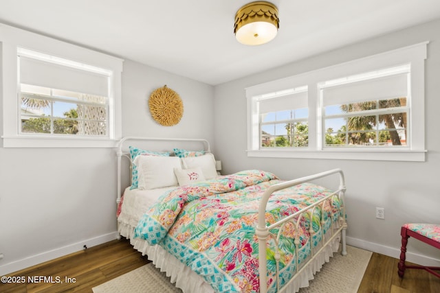 2902 W 5th St, Fernandina Beach, FL 32034 - bedroom with baseboards and wood finished floors
