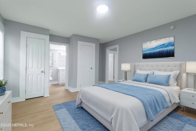 3321 Deason Ave, Jacksonville, FL 32254 - bedroom featuring light wood-type flooring, baseboards, and ensuite bath