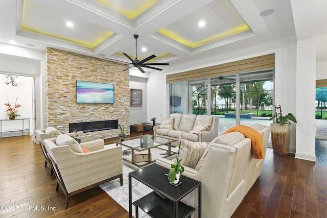 120 Hallowes Cv, Saint Johns, FL 32259 - living area featuring ceiling fan, dark wood-style flooring, a fireplace, beamed ceiling, and baseboards