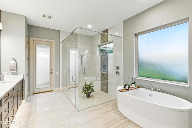 120 Hallowes Cv, Saint Johns, FL 32259 - bathroom with a soaking tub, a stall shower, vanity, and recessed lighting
