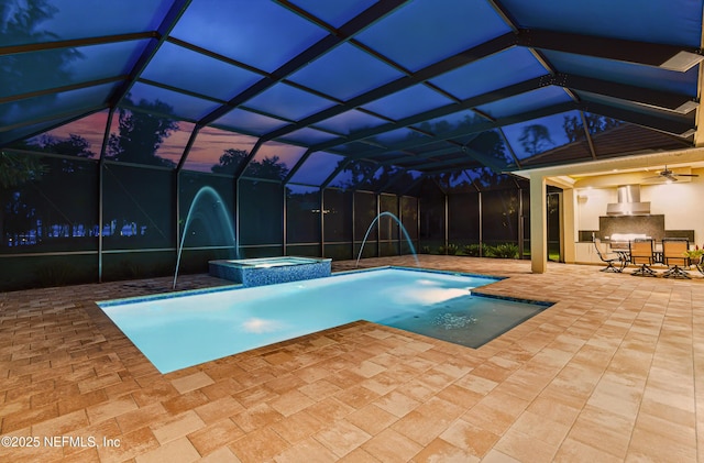 120 Hallowes Cv, Saint Johns, FL 32259 - pool at dusk with a patio, a pool with connected hot tub, a ceiling fan, outdoor dining area, and glass enclosure