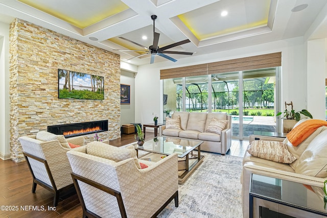 120 Hallowes Cv, Saint Johns, FL 32259 - living room with a fireplace, coffered ceiling, a ceiling fan, wood finished floors, and beam ceiling