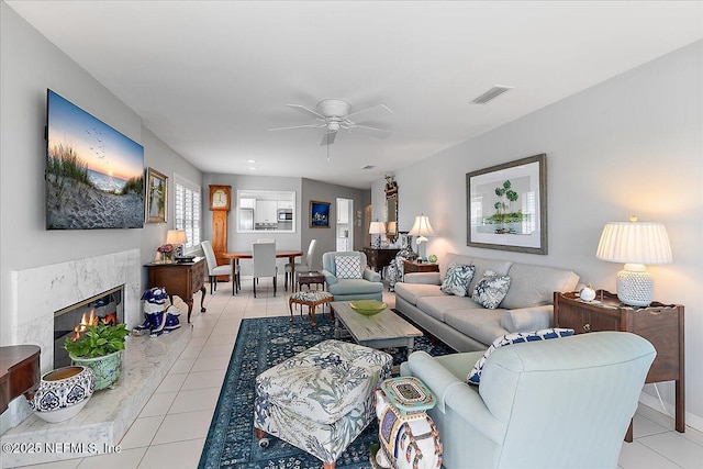 91 San Juan Dr Unit H8, Ponte Vedra Beach, FL 32082 - living area with light tile patterned floors, ceiling fan, and a premium fireplace