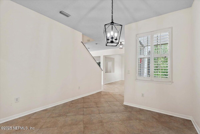 3357 Pegaso Ave, New Smyrna Beach, FL 32168 - unfurnished dining area featuring a chandelier and baseboards